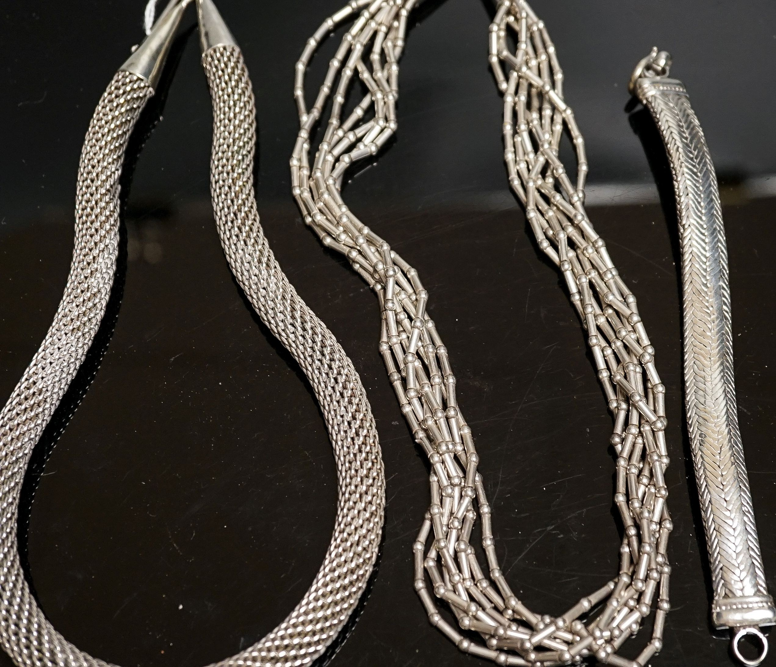 A 925 torque necklace, 46cm, a 925 multi strand necklace and a bracelet